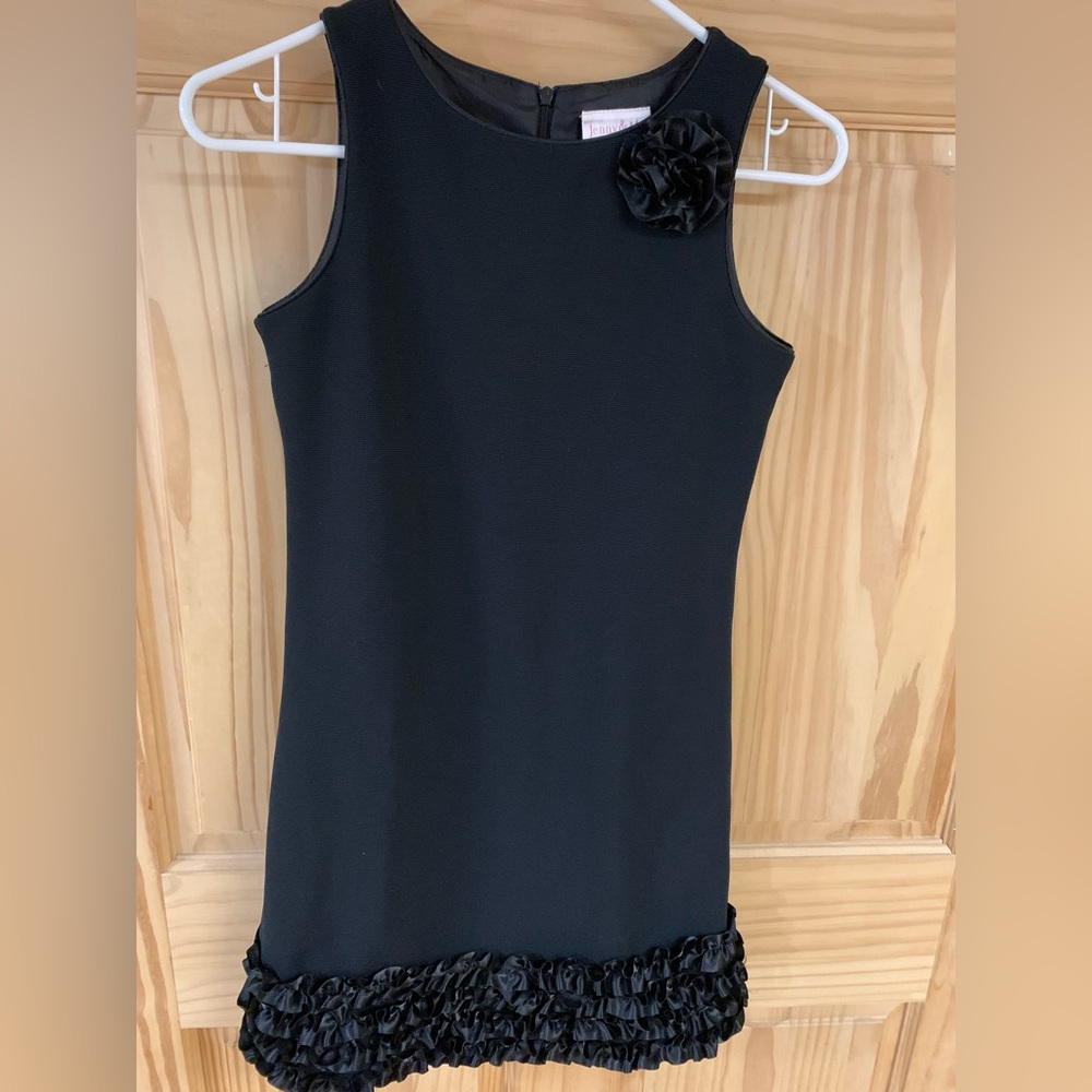 Black semi-formal dress with ruffle detail.